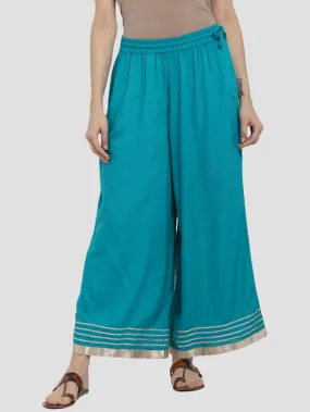 “Elegant Teal Green Palazzo Pants with Golden Border and Tassel Waistband - Luxe Fashion Piece”